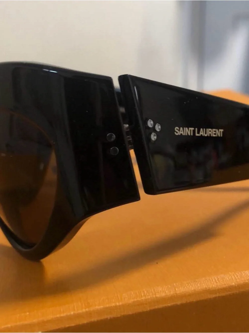 Yves Saint Laurent Black Women's Oval Sunglasses with Dark Lenses